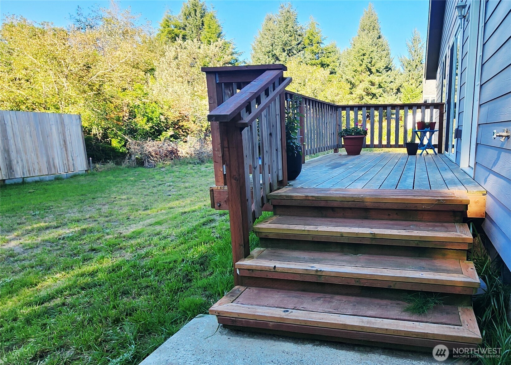 371 Centaurus Avenue Southwest Ocean Shores, WA 98569 - Photo 34 of 40 a view of backyard with barbeque grill and wooden fence