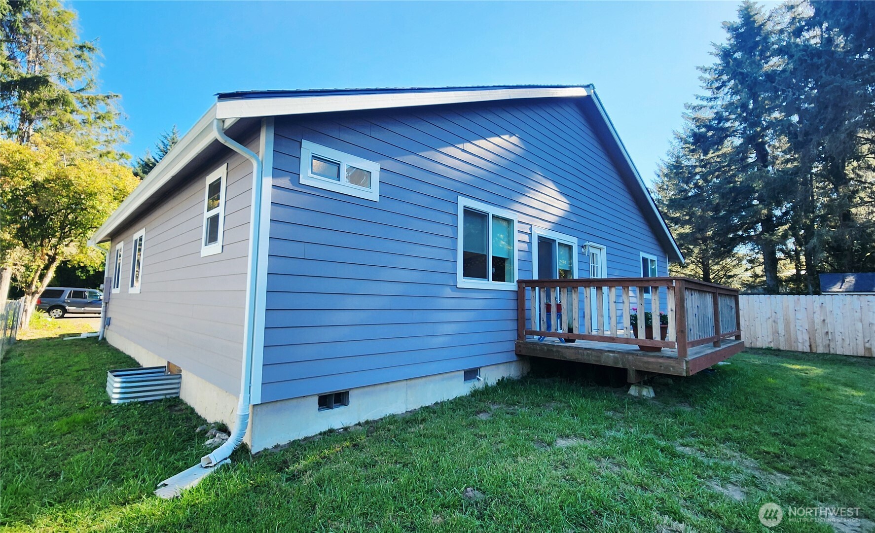 371 Centaurus Avenue Southwest Ocean Shores, WA 98569 - Photo 36 of 40 a view of a backyard with wooden fence