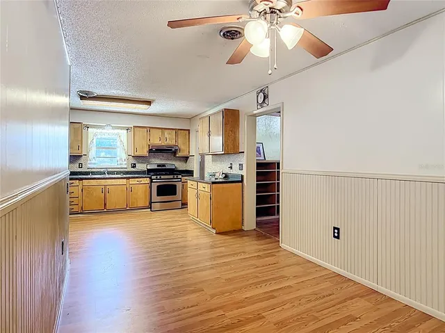 a view of a livingroom with wooden floor and closet