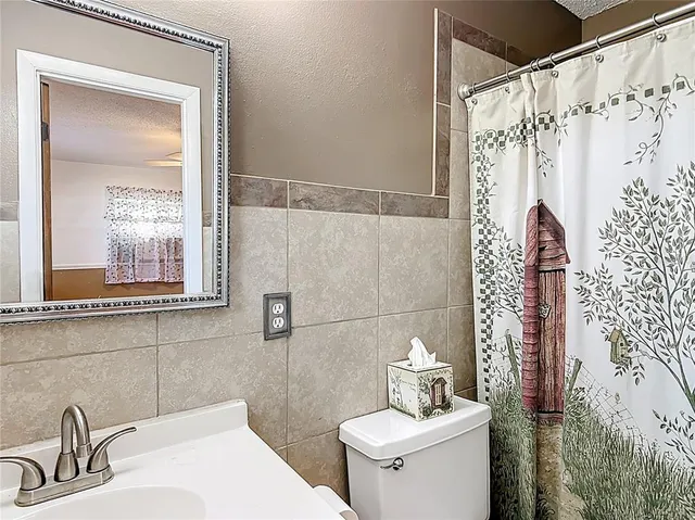 a view of a patio with table and chairs next to a yard