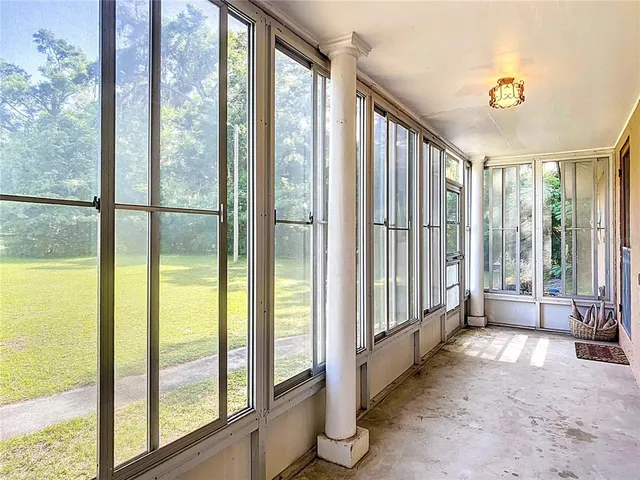a view of a house with swimming pool and a big yard