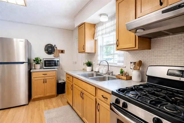 a view of a balcony with wooden floor