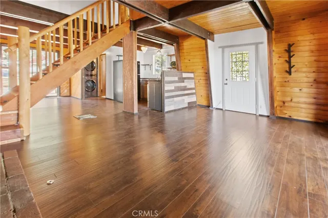 a view of an entryway with wooden floor