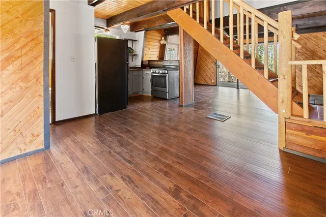 a view of an entryway with wooden floor