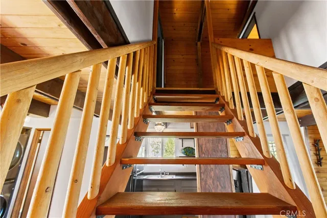a view of staircase with black and white walls