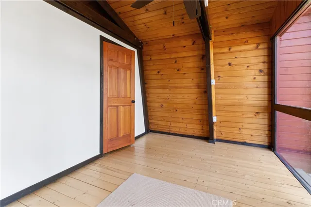 a view of an empty room with brick wall