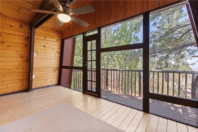a view of a room with wooden floor and balcony