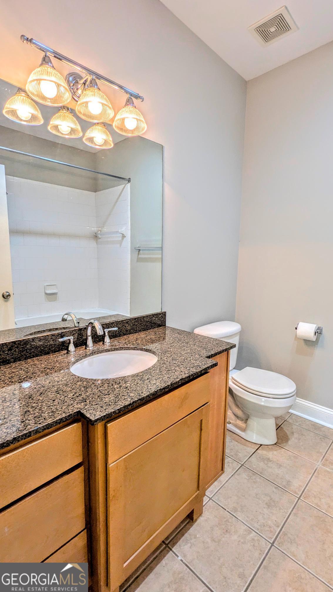 1500 Timothy Road, Unit A4 Athens, GA 30606 - Photo 22 of 35 a bathroom with a granite countertop sink and a toilet