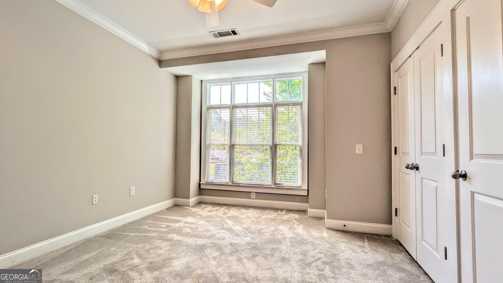 1500 Timothy Road, Unit A4 Athens, GA 30606 - Photo 24 of 35 an empty room with large windows