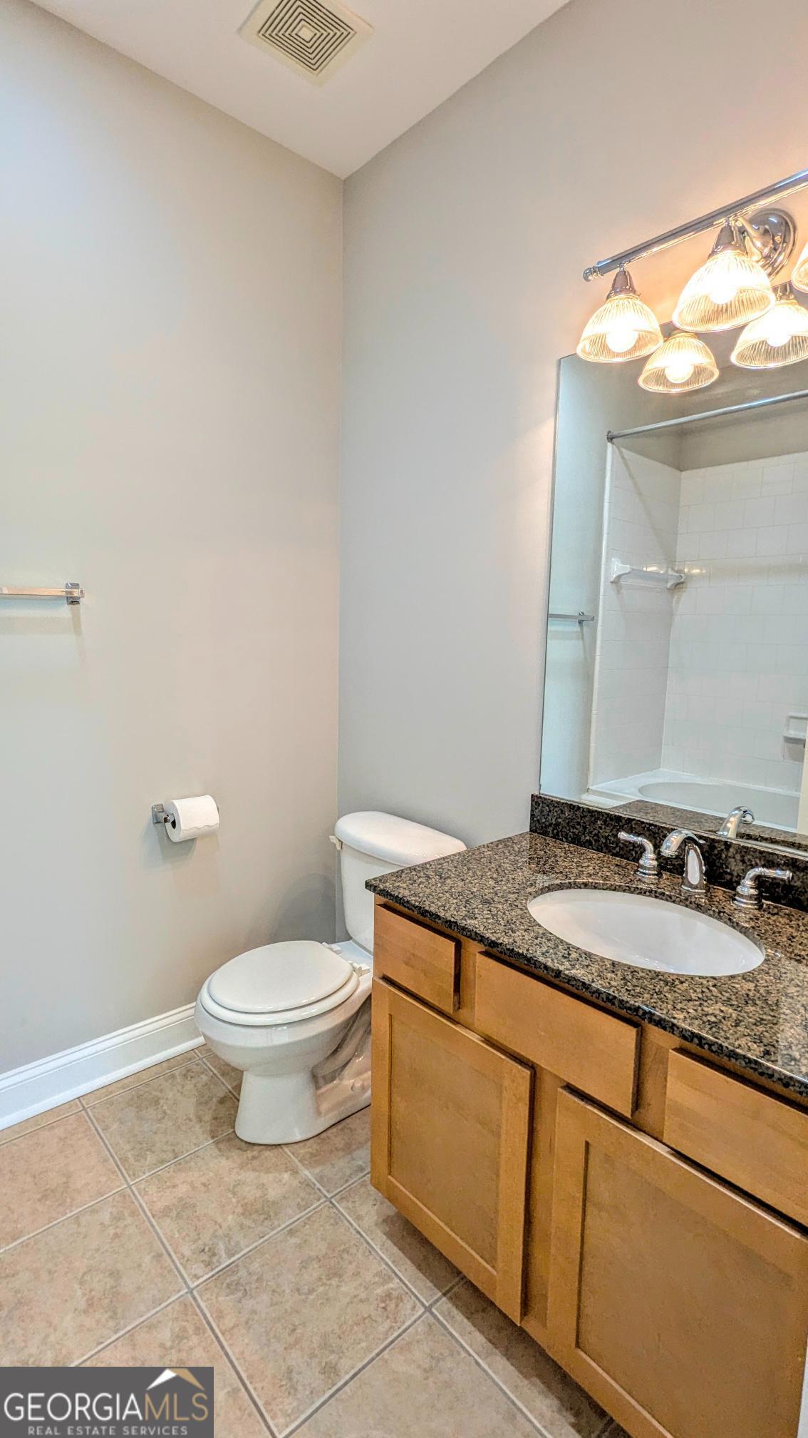 1500 Timothy Road, Unit A4 Athens, GA 30606 - Photo 27 of 35 a bathroom with a granite countertop sink and a mirror