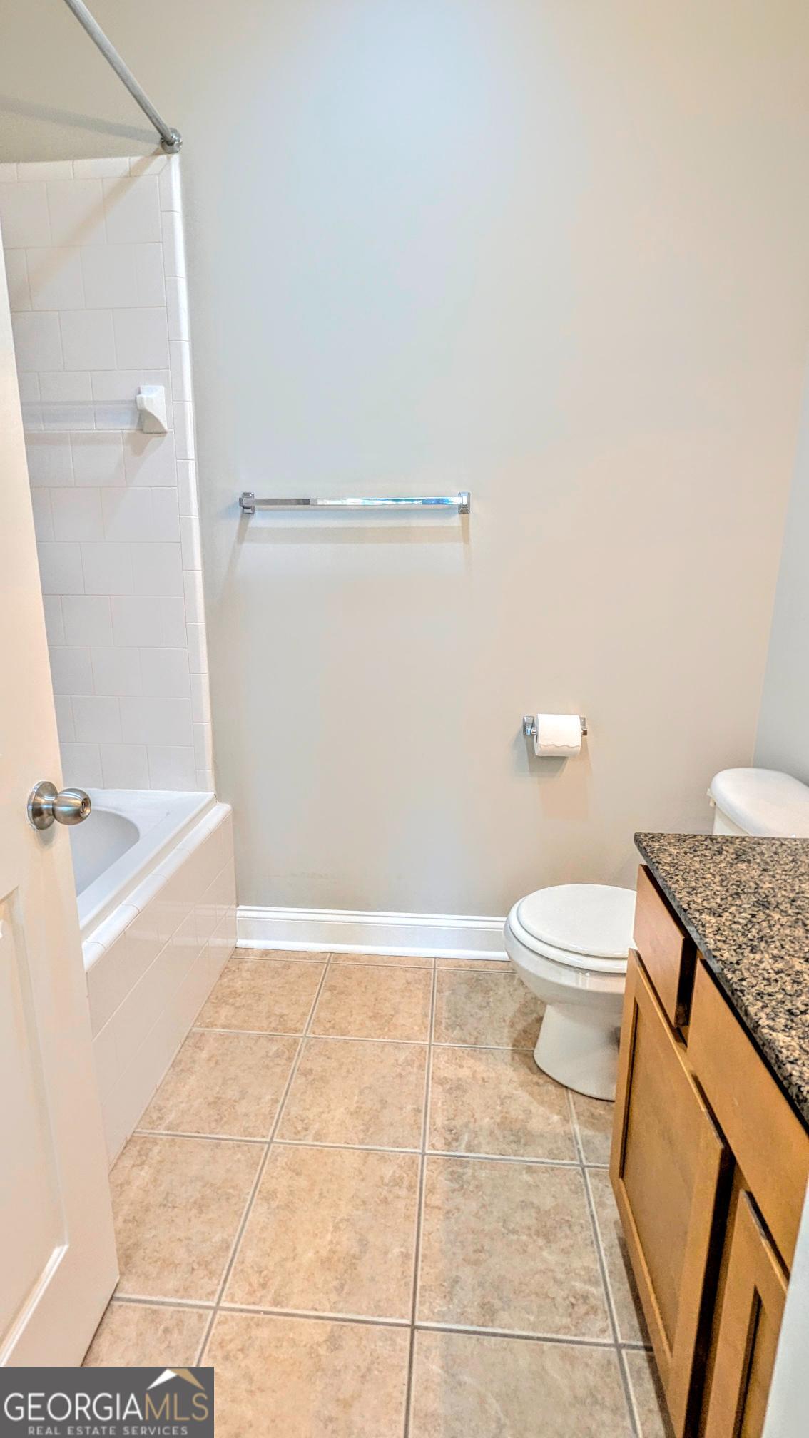 1500 Timothy Road, Unit A4 Athens, GA 30606 - Photo 28 of 35 a bathroom with a granite countertop shower and a toilet