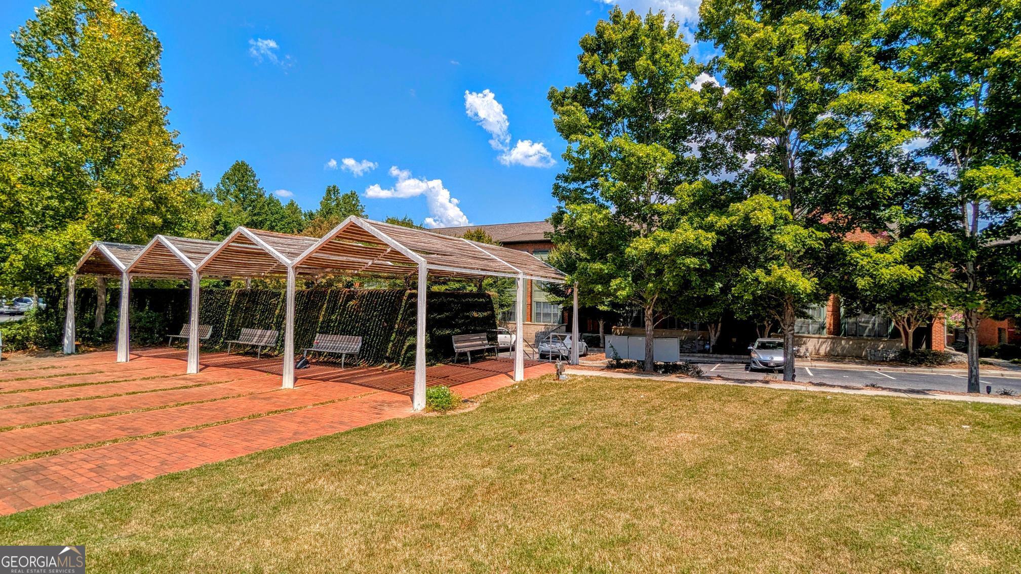 1500 Timothy Road, Unit A4 Athens, GA 30606 - Photo 31 of 35 a view of a house with a backyard and a patio