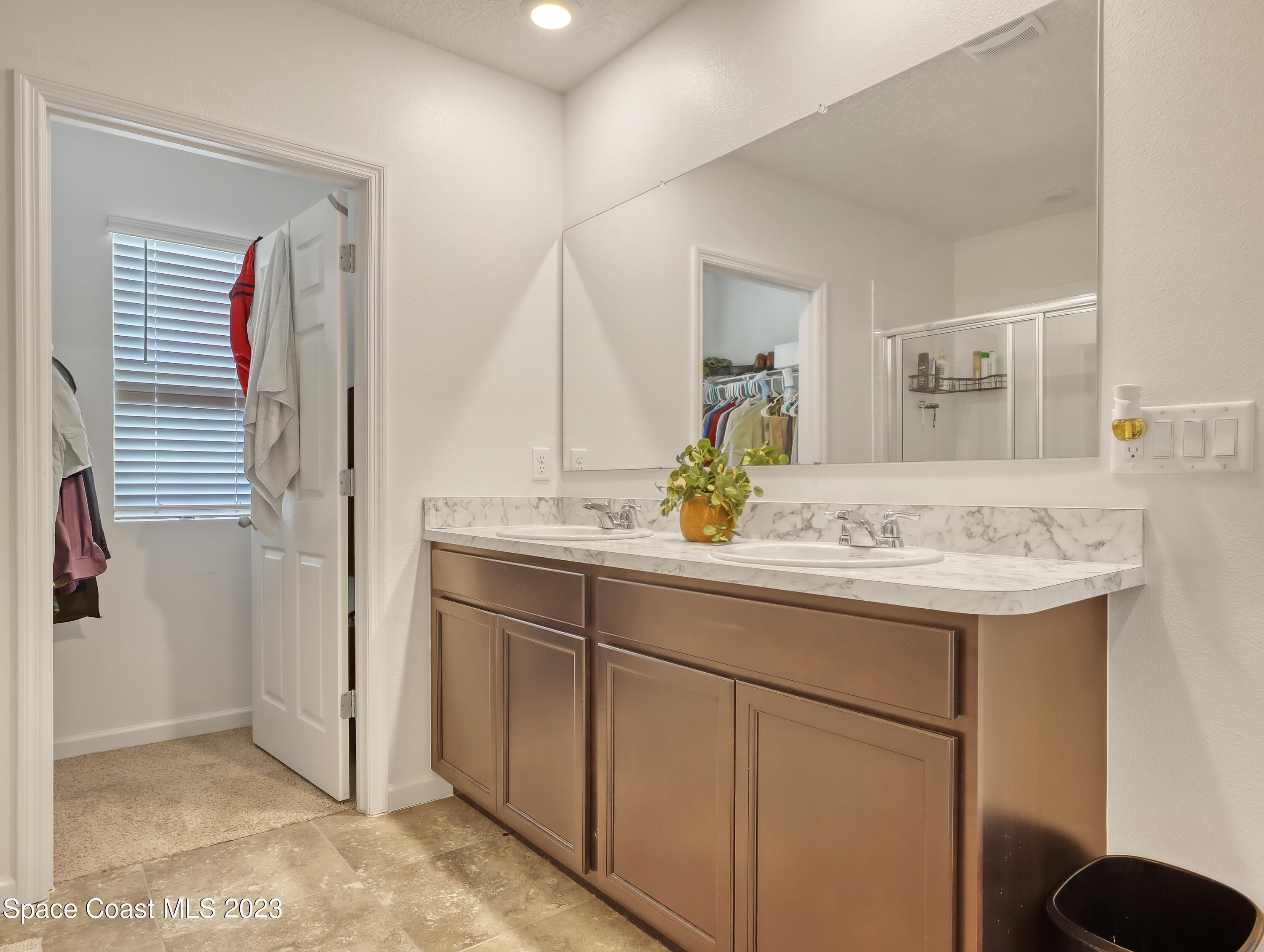 1652 Saxton Road Cocoa, FL 32926 - Photo 30 of 53 a bathroom with a sink and a mirror
