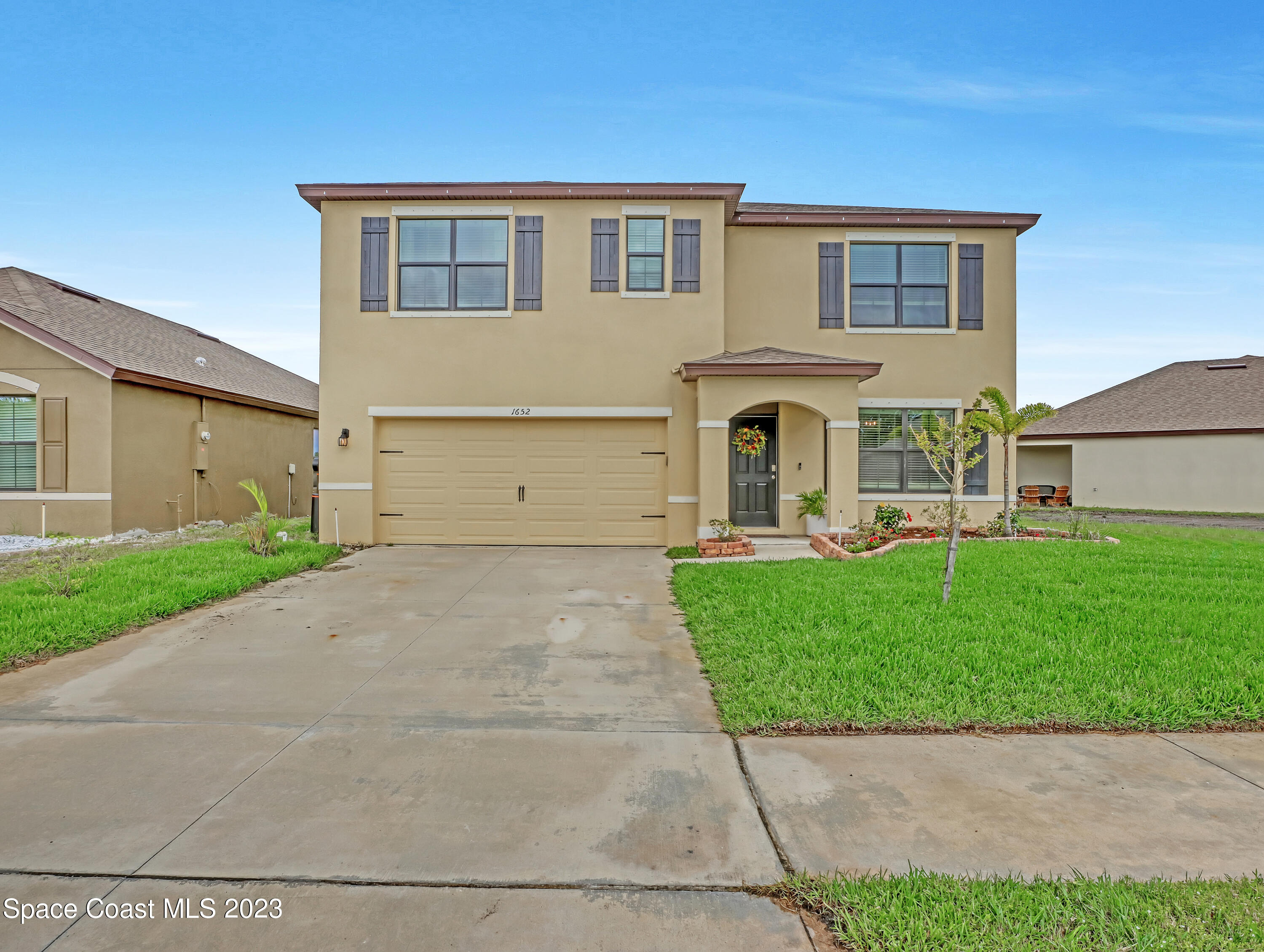 1652 Saxton Road Cocoa, FL 32926 - Photo 3 of 53 a view of a house with a garden