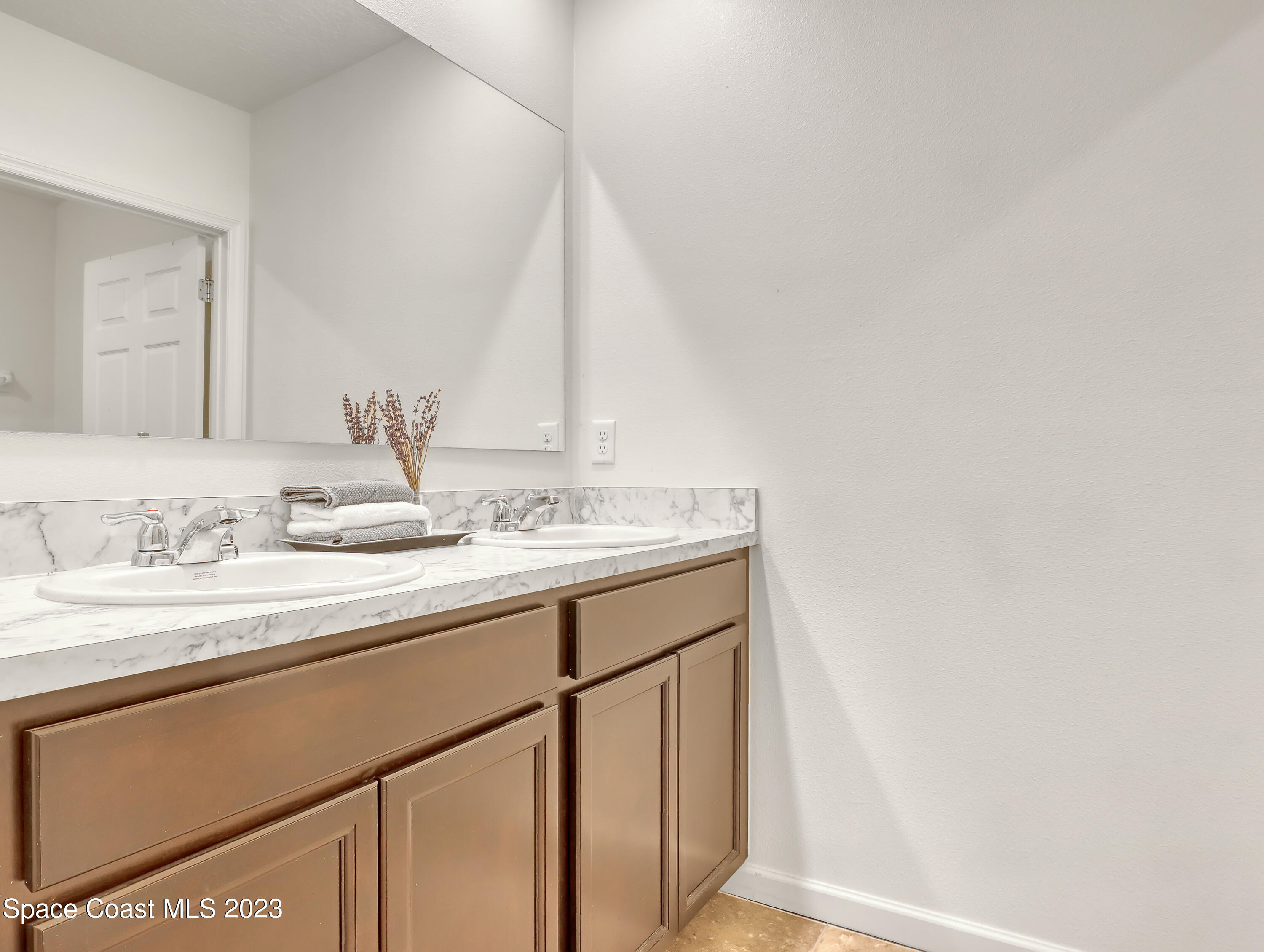 1652 Saxton Road Cocoa, FL 32926 - Photo 34 of 53 a bathroom with a sink and a mirror