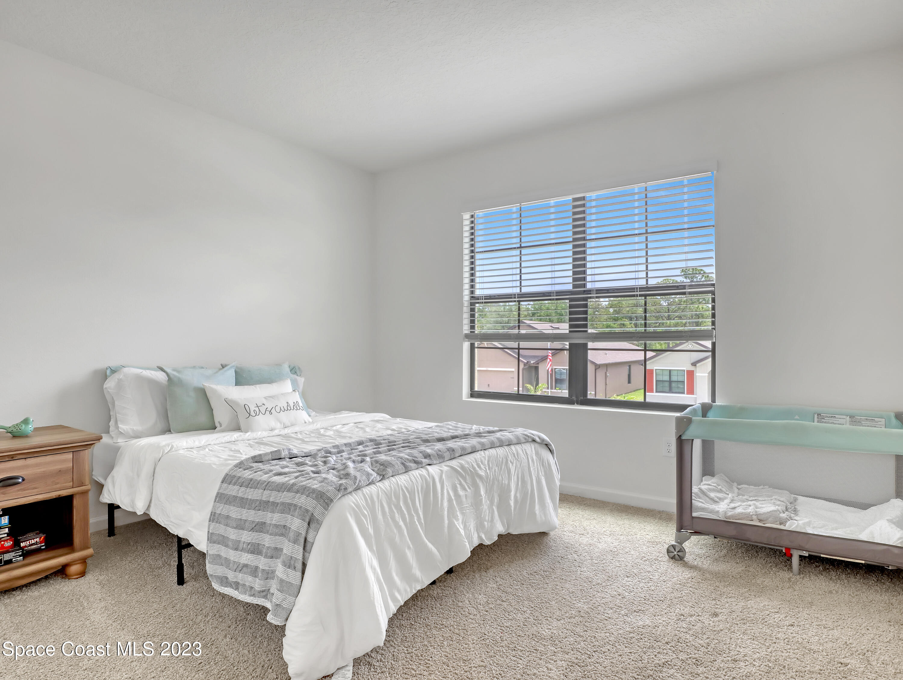 1652 Saxton Road Cocoa, FL 32926 - Photo 39 of 53 a bedroom with a bed and a window