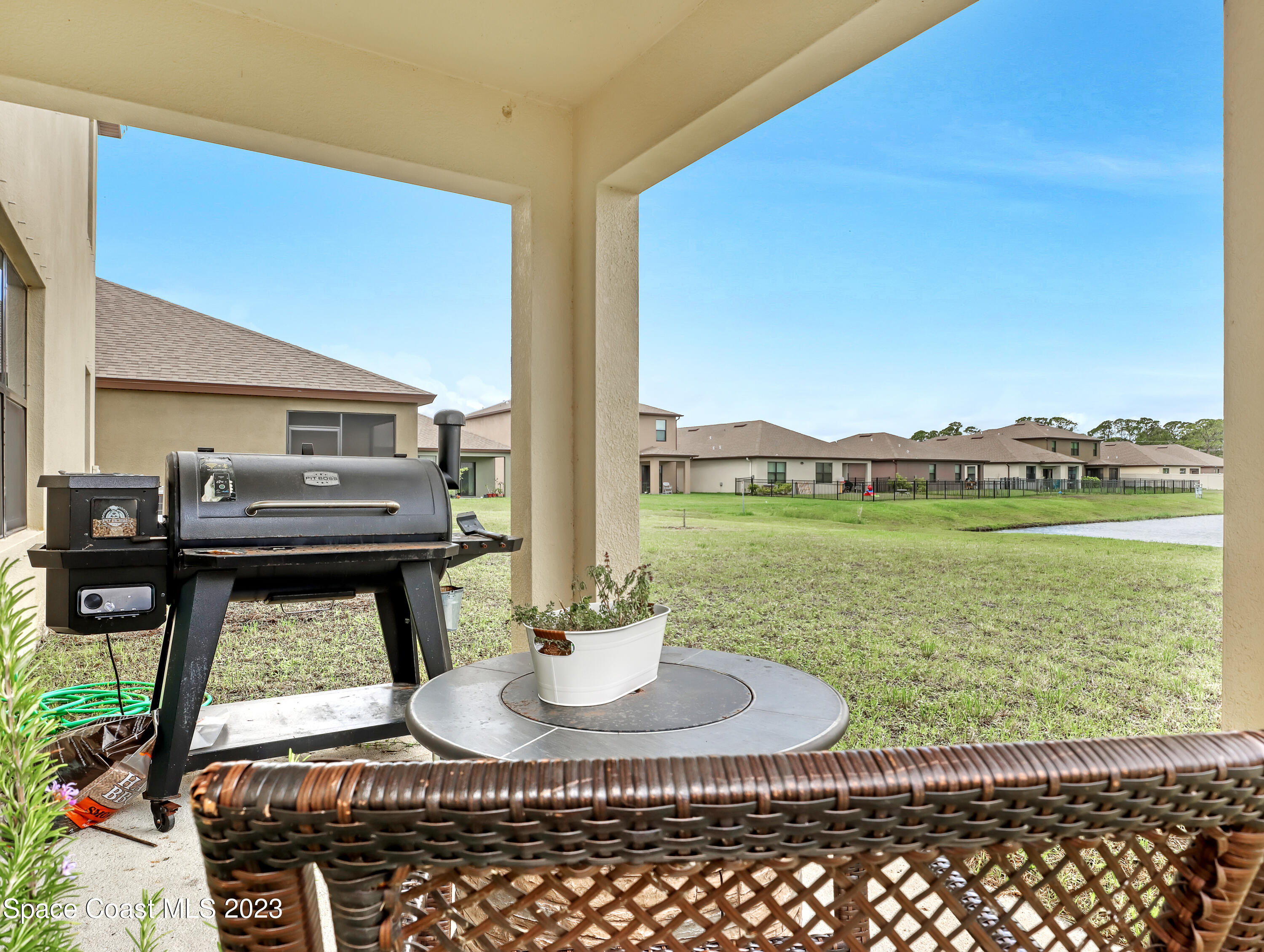 1652 Saxton Road Cocoa, FL 32926 - Photo 42 of 53 a dining room with furniture and a floor to ceiling window