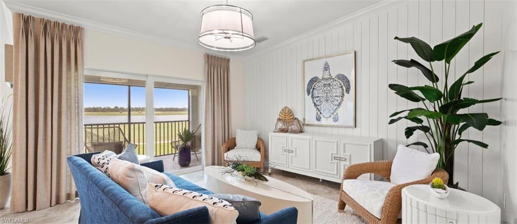 5466 Double Eagle Circle, Unit 3423 Ave Maria, FL 34142 - Photo 12 of 24 Living area with crown molding, wooden walls, and light tile patterned floors