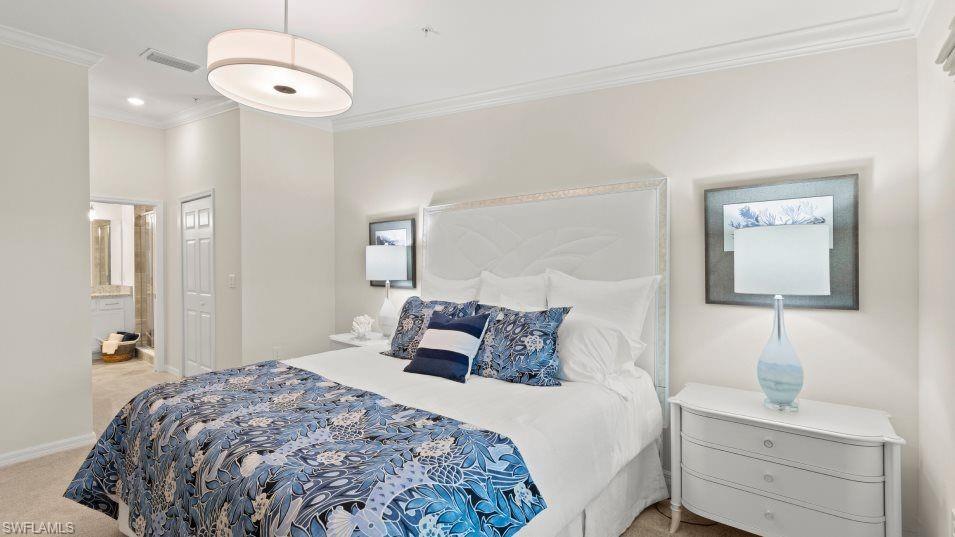 5466 Double Eagle Circle, Unit 3423 Ave Maria, FL 34142 - Photo 15 of 24 Bedroom with ornamental molding and light carpet