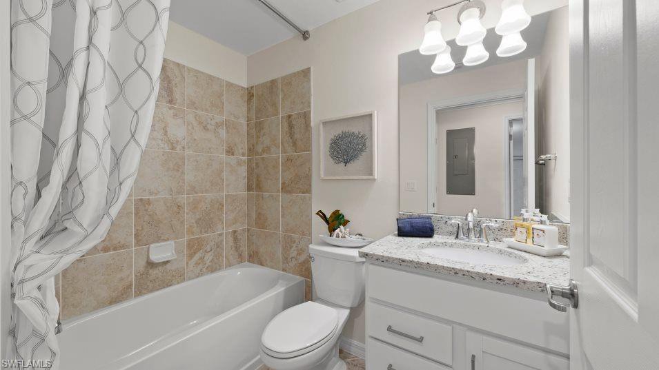 5466 Double Eagle Circle, Unit 3423 Ave Maria, FL 34142 - Photo 18 of 24 Full bathroom with shower / tub combo, electric panel, vanity, toilet, and a chandelier