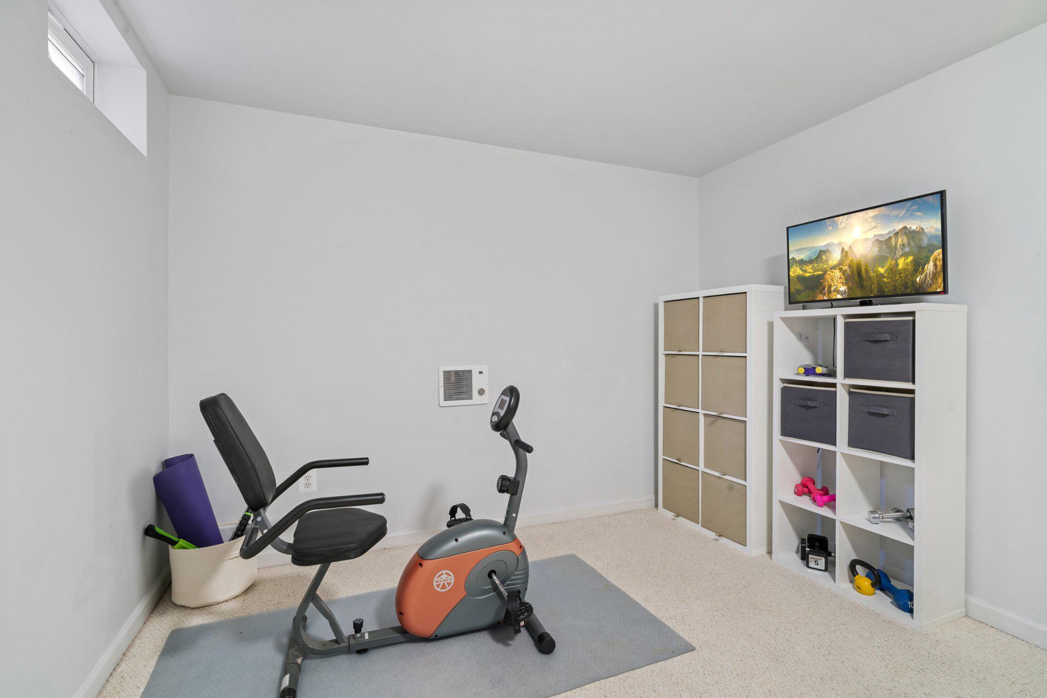 13916 Lullaby Road Germantown, MD 20874 - Photo 32 of 45 Exercise area on lower level.