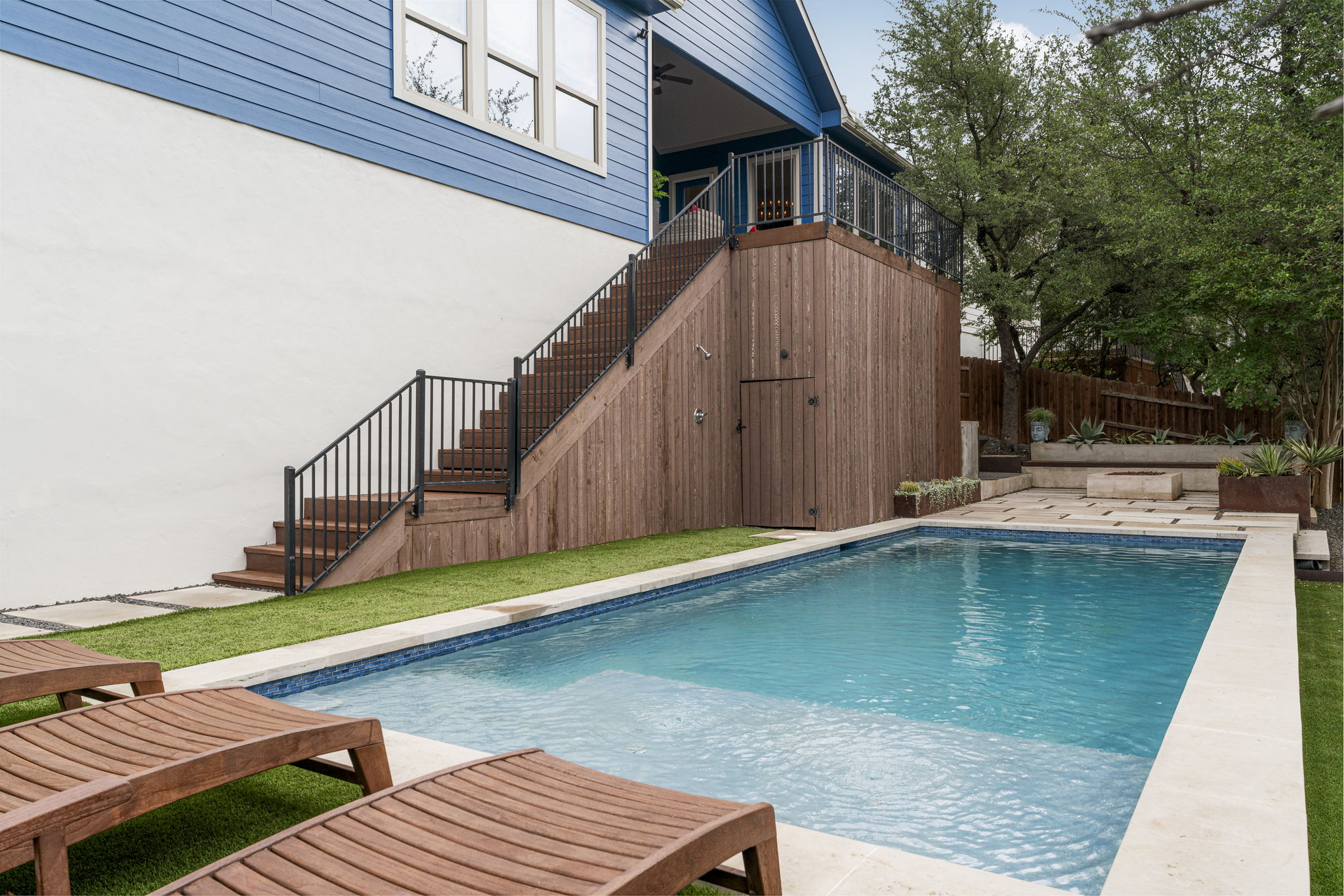 288 Hazy Hills Loop Dripping Springs, TX 78620 - Photo 34 of 40 Designed for both relaxation and entertaining, the outdoor space includes a pool with auto-refill, an outdoor shower, a kitchen, a fire pit, and multiple areas to gather or unwind.