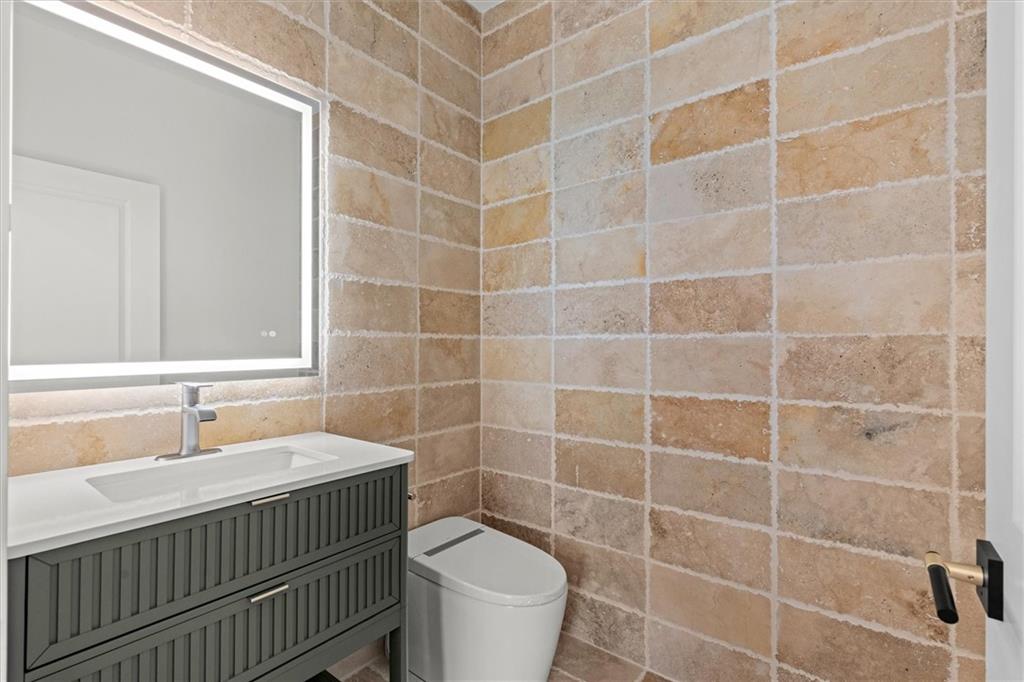 752 Crystal Bay Road Villa Rica, GA 30180 - Photo 14 of 60 a bathroom with a sink toilet and a mirror