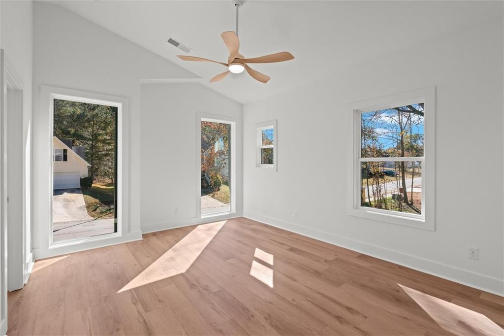 752 Crystal Bay Road Villa Rica, GA 30180 - Photo 17 of 60 a view of empty room with wooden floor and fan