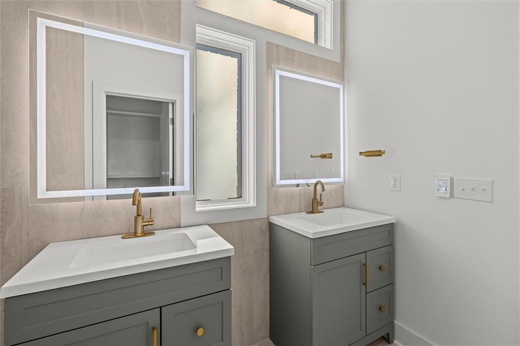 752 Crystal Bay Road Villa Rica, GA 30180 - Photo 21 of 60 a bathroom with a sink and a mirror