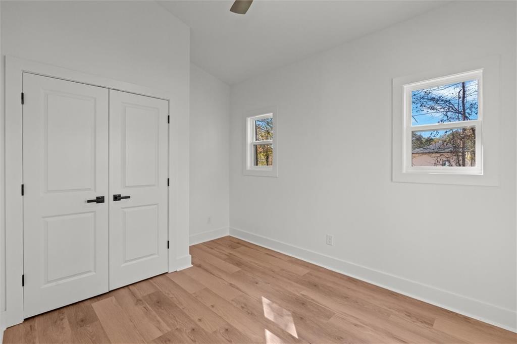 752 Crystal Bay Road Villa Rica, GA 30180 - Photo 24 of 60 a view of room with window and hardwood floor