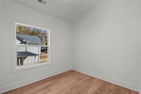 a kitchen with stainless steel appliances granite countertop a sink a stove a refrigerator and cabinets