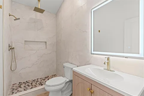 a white kitchen with sink and cabinets