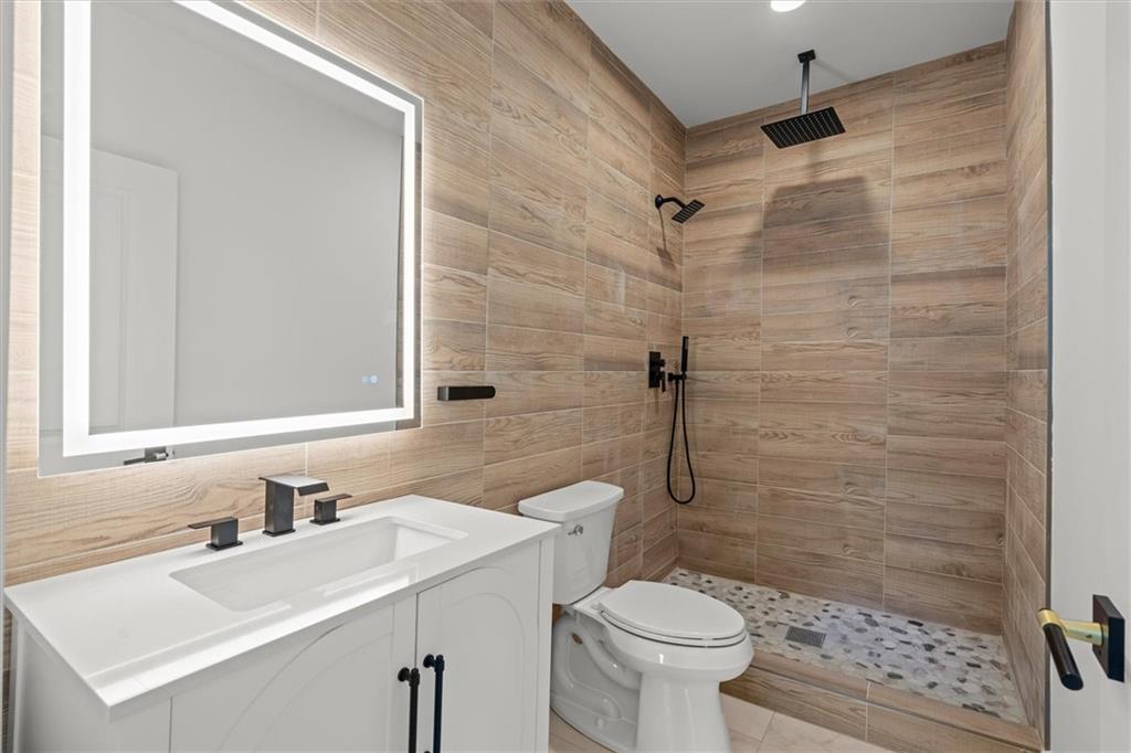 752 Crystal Bay Road Villa Rica, GA 30180 - Photo 30 of 60 a bathroom with a sink toilet and shower