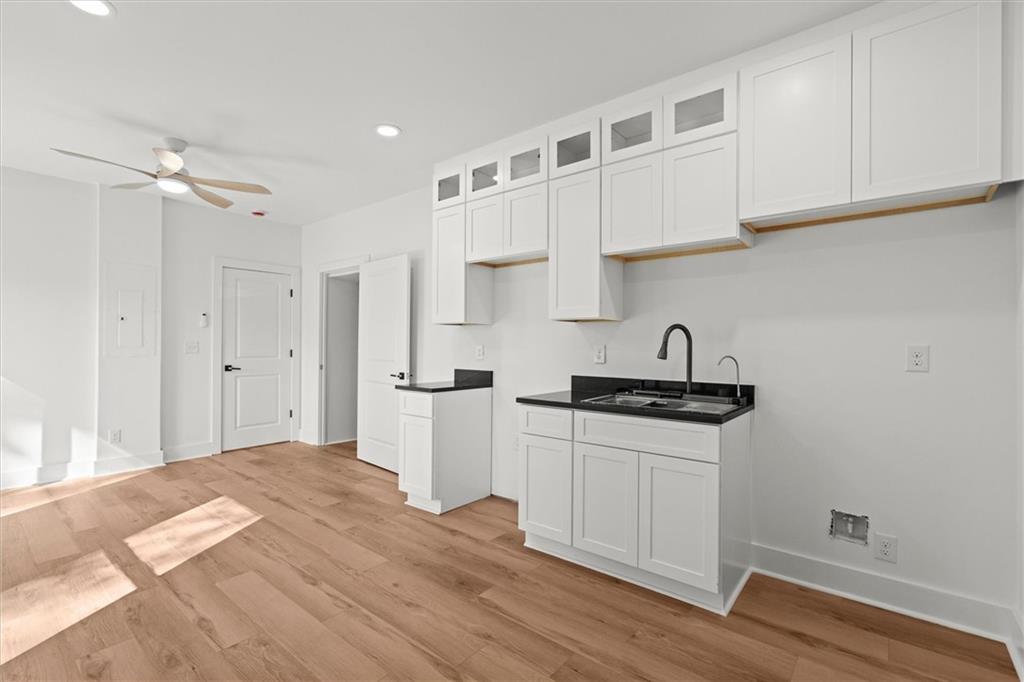 752 Crystal Bay Road Villa Rica, GA 30180 - Photo 33 of 60 a kitchen with stainless steel appliances granite countertop a sink a stove a refrigerator and cabinets