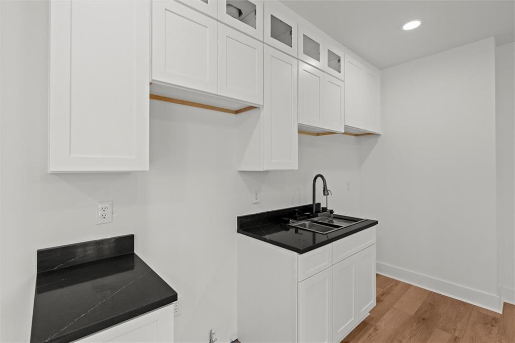 752 Crystal Bay Road Villa Rica, GA 30180 - Photo 34 of 60 a white kitchen with sink and cabinets