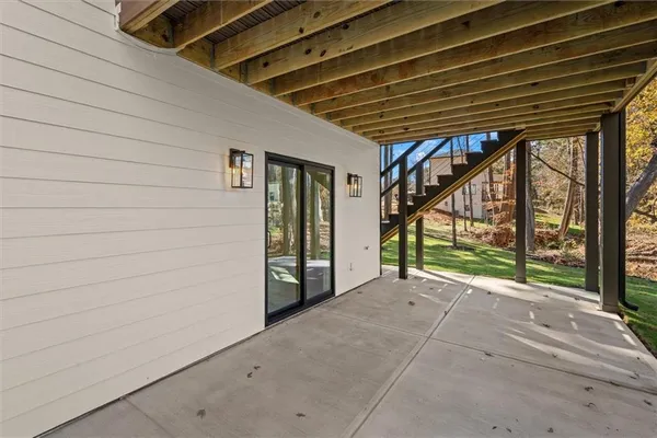 a view of a house with a yard and deck