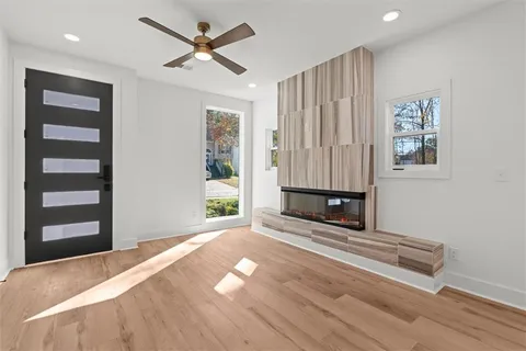 a large white kitchen with kitchen island a stove a sink dishwasher and a refrigerator