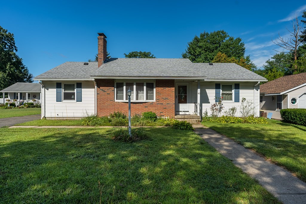 42 Kulig Street Springfield, MA 01104 - Photo 1 of 33 a front view of a house with a garden