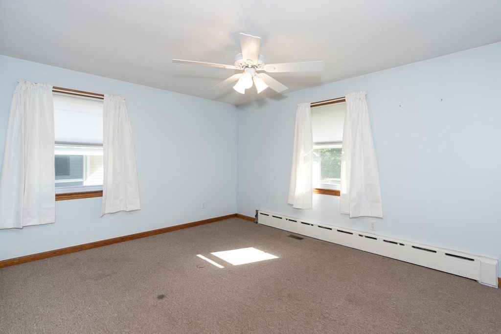 42 Kulig Street Springfield, MA 01104 - Photo 18 of 33 an empty room with a window and a fan