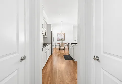 a kitchen with counter top space a sink appliances and cabinets