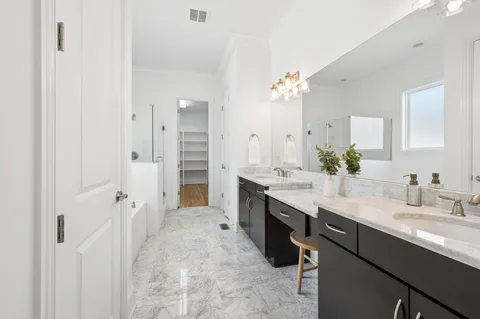 a bathroom with a bathtub and a shower