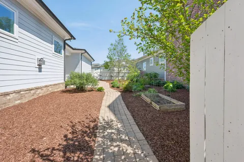 a view of a house with a yard and plants