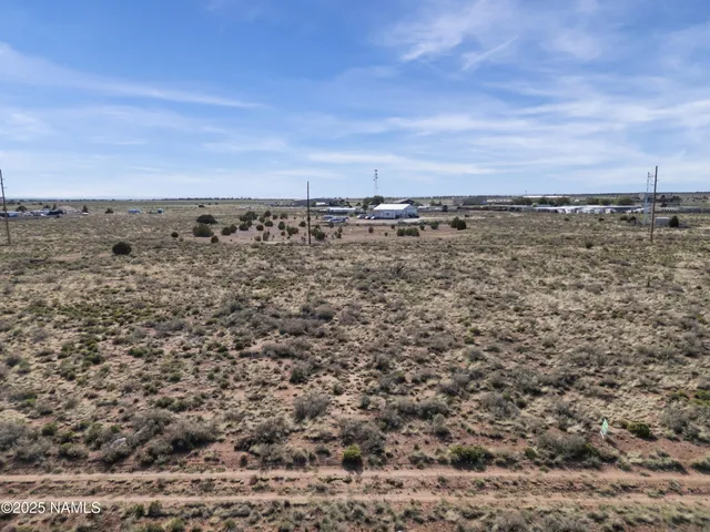 a view of a large body of water with a building in back