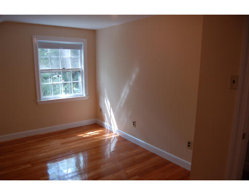 113 Monsen Road Concord, MA 01742 - Photo 10 of 14 a view of an empty room with wooden floor and a window