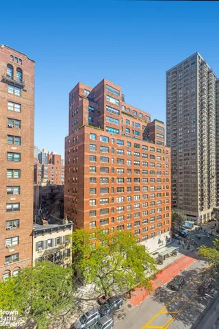 a front view of a building with a yard