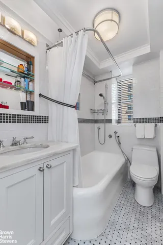 a bathroom with a sink a toilet and a bathtub