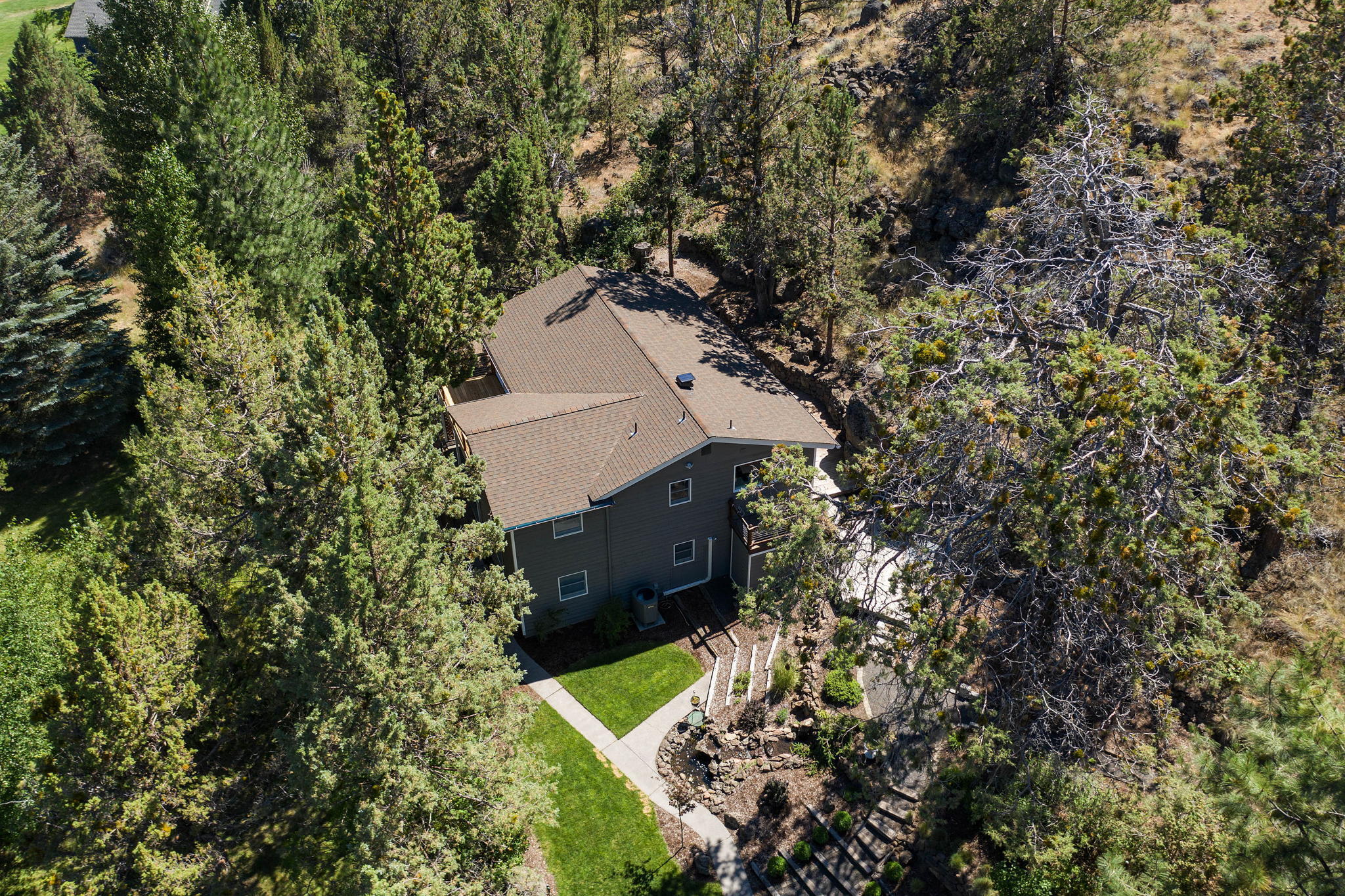 65161 Smokey Butte Road Bend, OR 97703 - Photo 5 of 45 an aerial view of a house with a yard