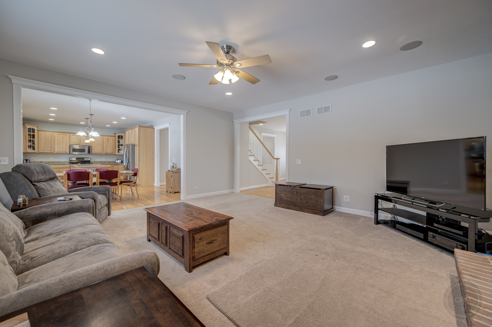 5S263 Middle Road Naperville, IL 60563 - Photo 11 of 46 a living room with furniture and a flat screen tv