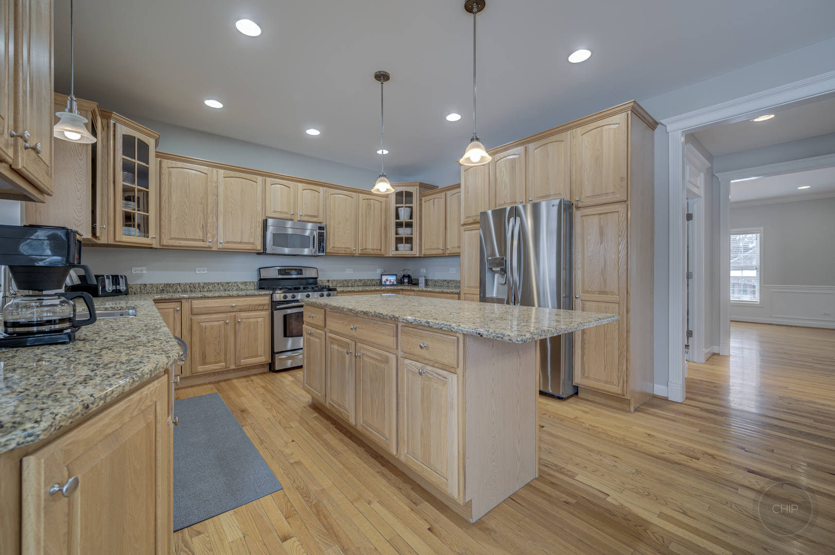 5S263 Middle Road Naperville, IL 60563 - Photo 13 of 46 a kitchen with kitchen island granite countertop wooden cabinets and stainless steel appliances