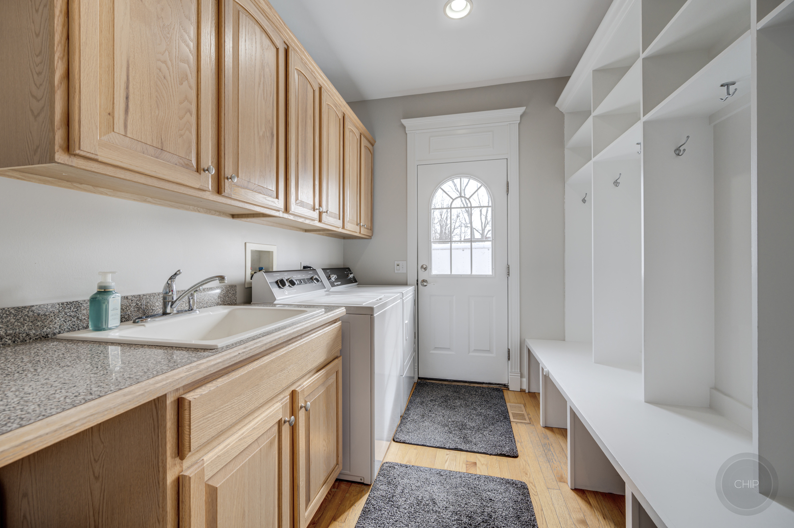 5S263 Middle Road Naperville, IL 60563 - Photo 16 of 46 a kitchen with granite countertop a sink dishwasher stove and cabinets with wooden floor